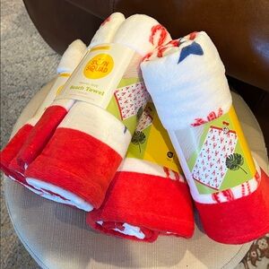 A set of 4 Sun Squad Red and White Beach Towel with lobster design.